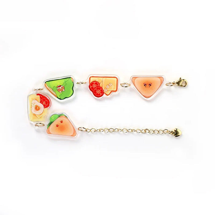 Custom acrylic charm bracelet with cute sandwich and food designs, gold chain, white background
