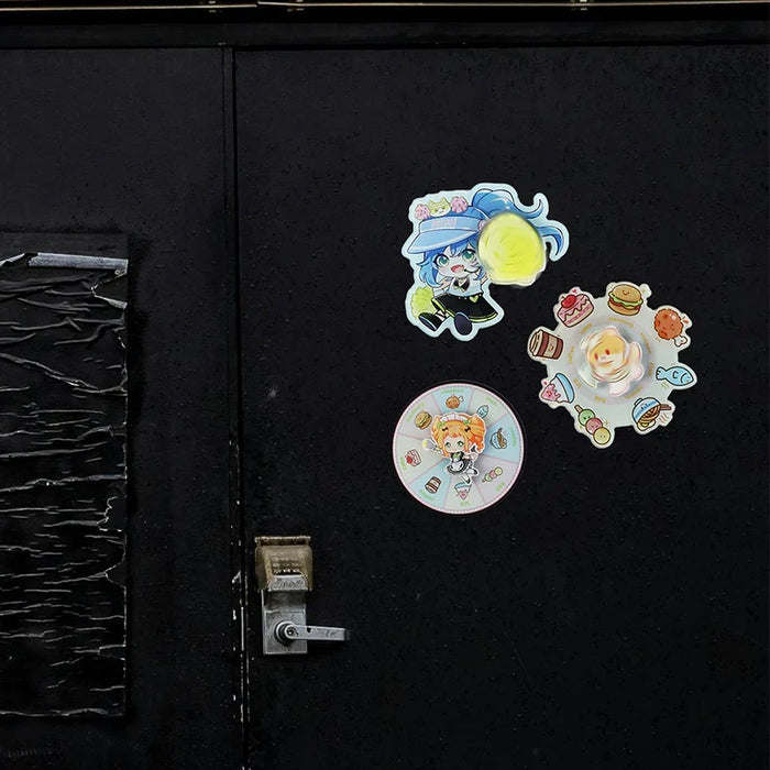 Colorful anime-themed custom acrylic stickers on a black door, with food and character designs.