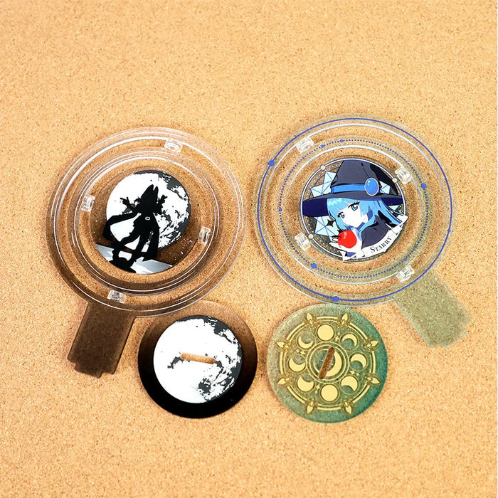 Custom round acrylic standees with anime and silhouette designs on cork background