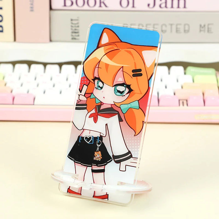 Custom acrylic phone holder with cute anime cat girl design on desk