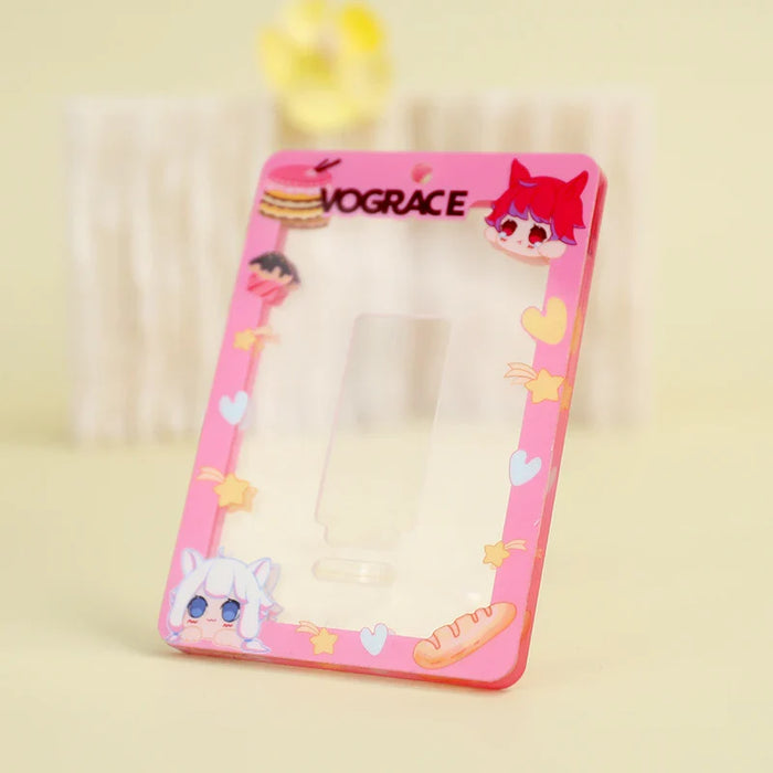 Custom acrylic photocard holder with pink anime border, cartoon food, and character designs