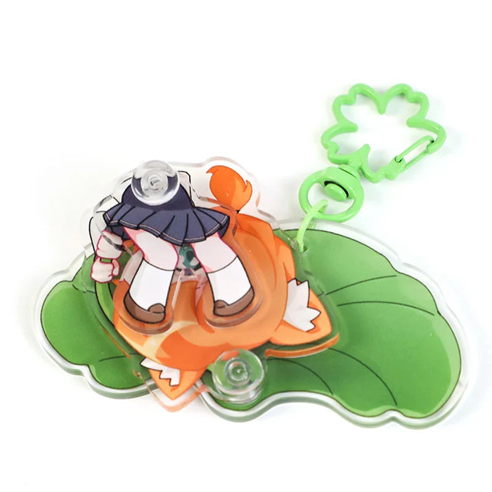 Custom acrylic swing keychain featuring cartoon girl on a leaf with a green clasp.