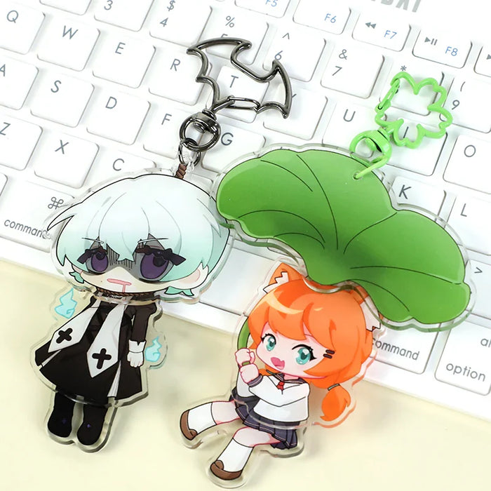 Custom acrylic anime keychains with colorful characters on a white keyboard