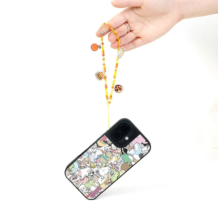 Hand holding a custom beaded acrylic phone charm attached to a phone with a cute cartoon case
