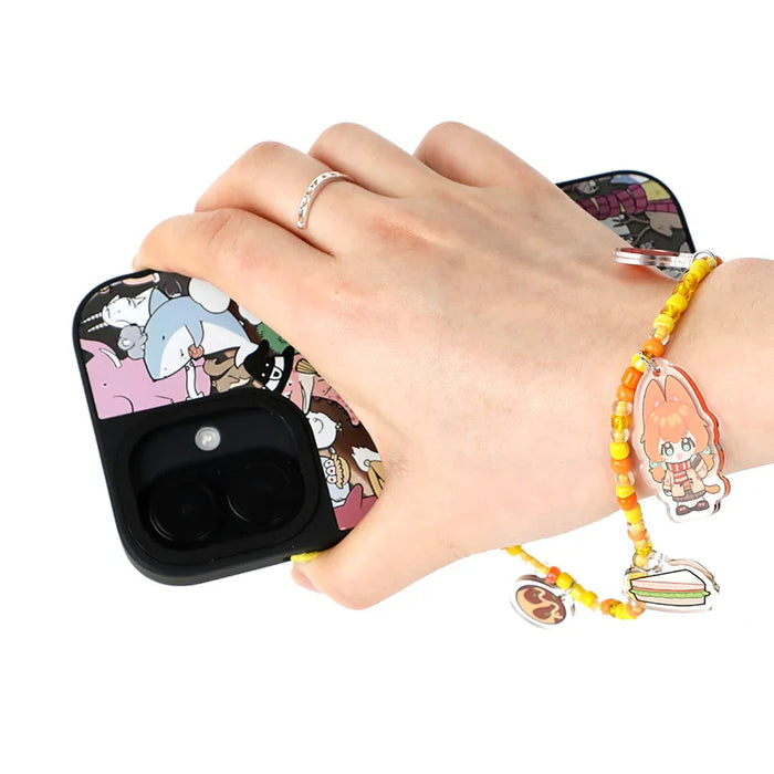 Hand holding a phone with an anime case and custom beaded acrylic phone charm