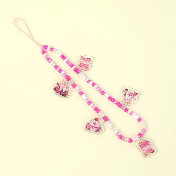 Custom pink beaded acrylic phone charm with cute cartoon character charms on light background