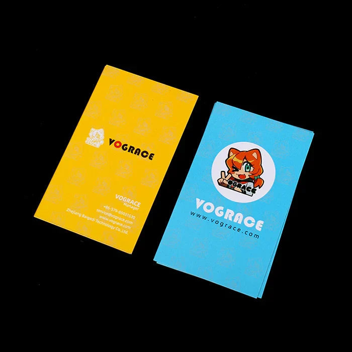 Two colorful convention pack cards with cartoon mascot and contact information on black background