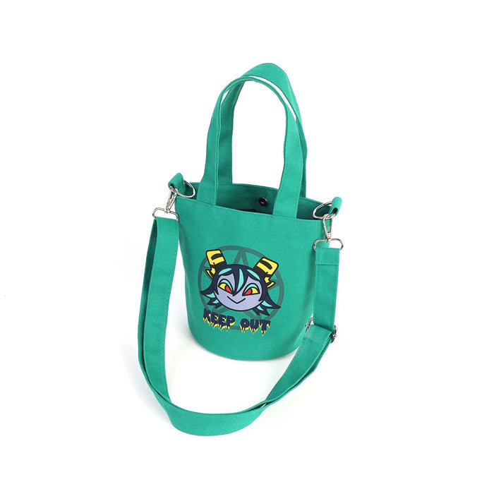Green canvas bucket bag with anime-style cartoon face and 'KEEP OUT' text, detachable strap