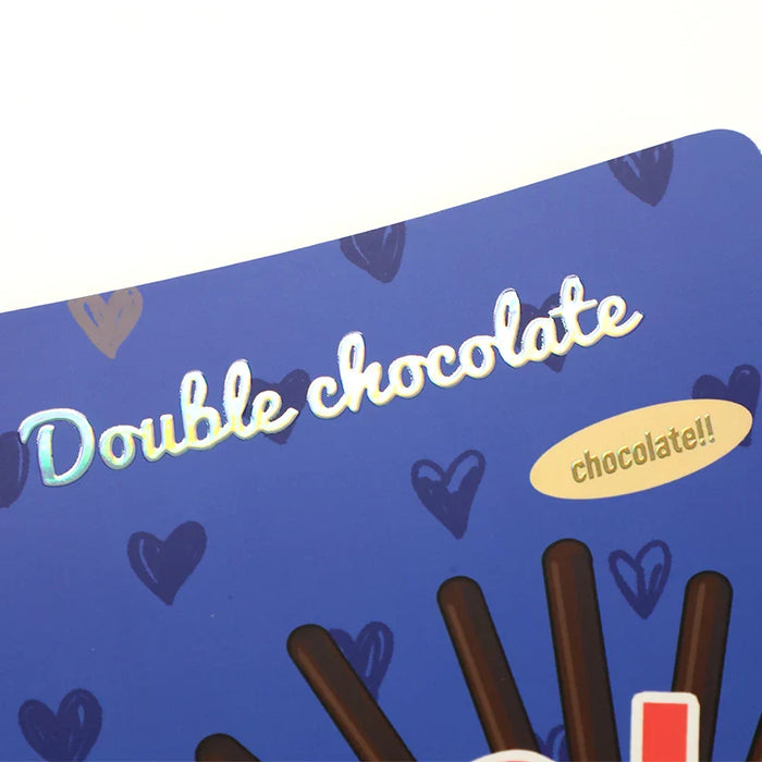 Custom notebook with holographic cold foil stamping, blue cover, chocolate-themed design.