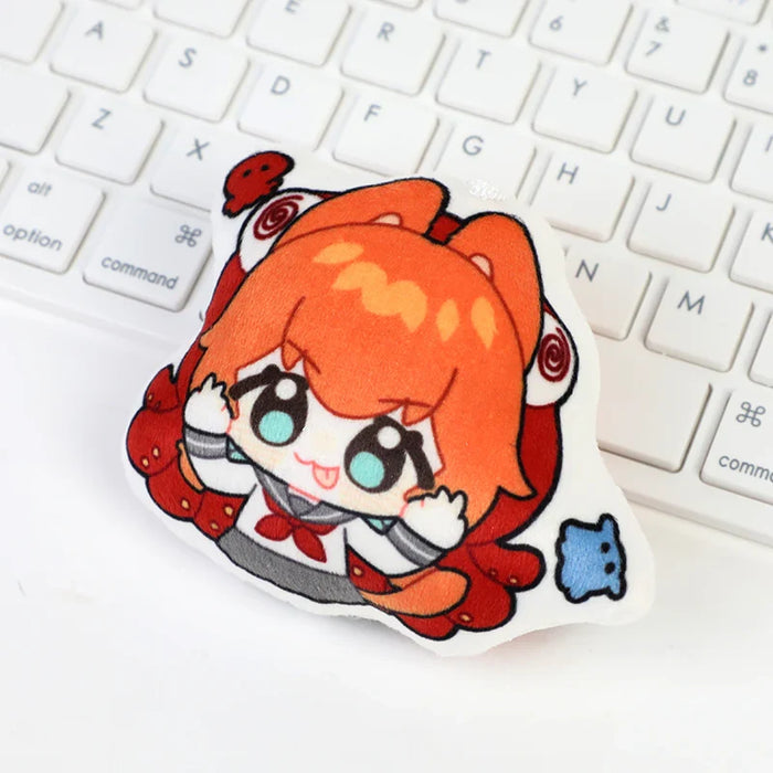 Custom anime chibi body pillow keychain with orange-haired character on white keyboard