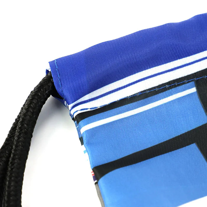 Close-up of custom blue drawstring backpack with black cord and printed graphic detail.