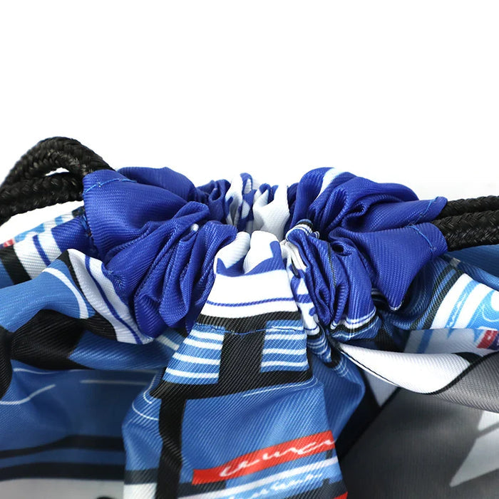 Close-up of custom blue drawstring backpack with black cords and graphic print design
