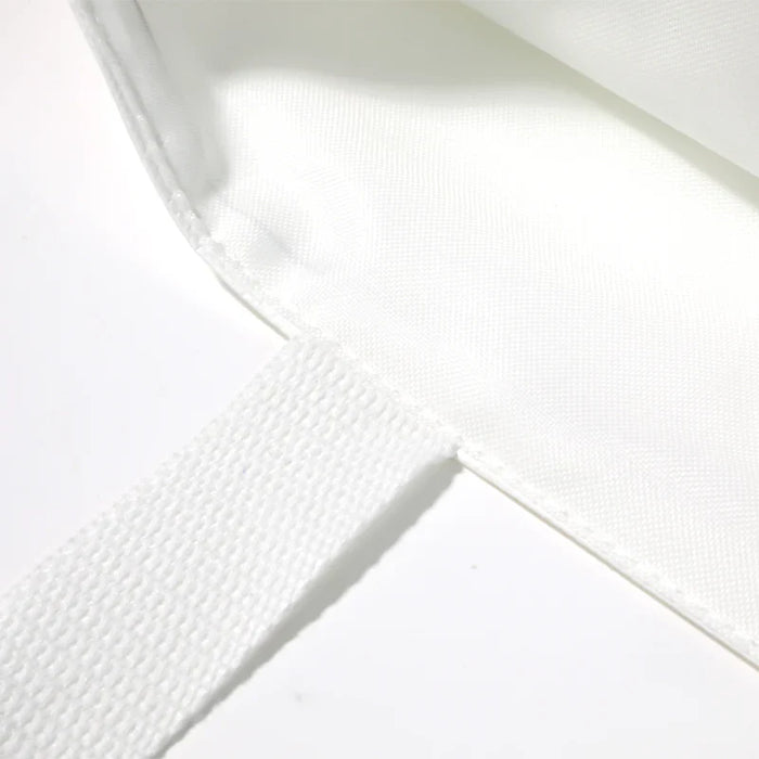 Close-up of white custom DuPont paper tote bag corner and handle detail