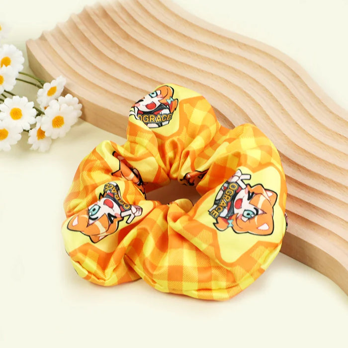 Custom yellow plaid hair tie scrunchie with cartoon fox pattern on a light background