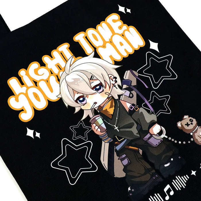 Custom black canvas tote bag with anime character, star accents, and bold text design