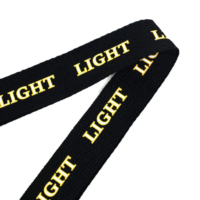Black woven tote bag strap with yellow 'LIGHT' text, close-up product detail.