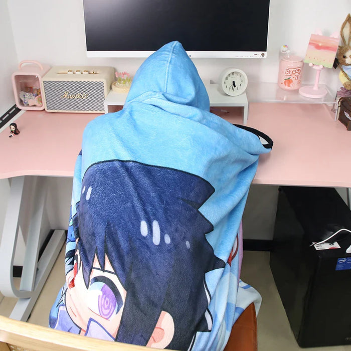 Custom hooded blanket with anime character print draped over person at desk