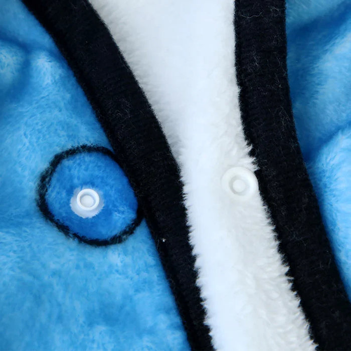 Close-up of soft blue and white custom hooded blanket with button detail