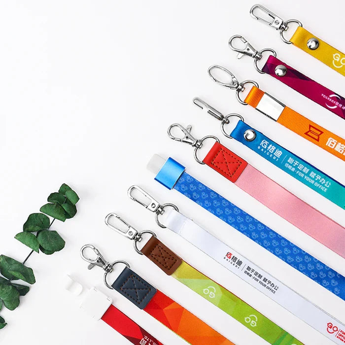 Assorted colorful custom lanyards with metal clips arranged on a white background