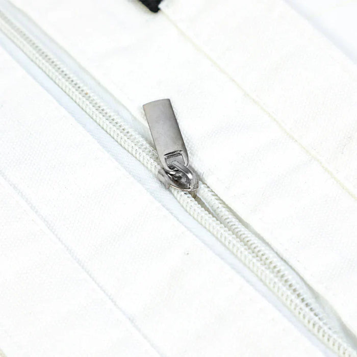 Close-up of white fabric zipper with metal pull, ideal for tote bags or promotional merchandise