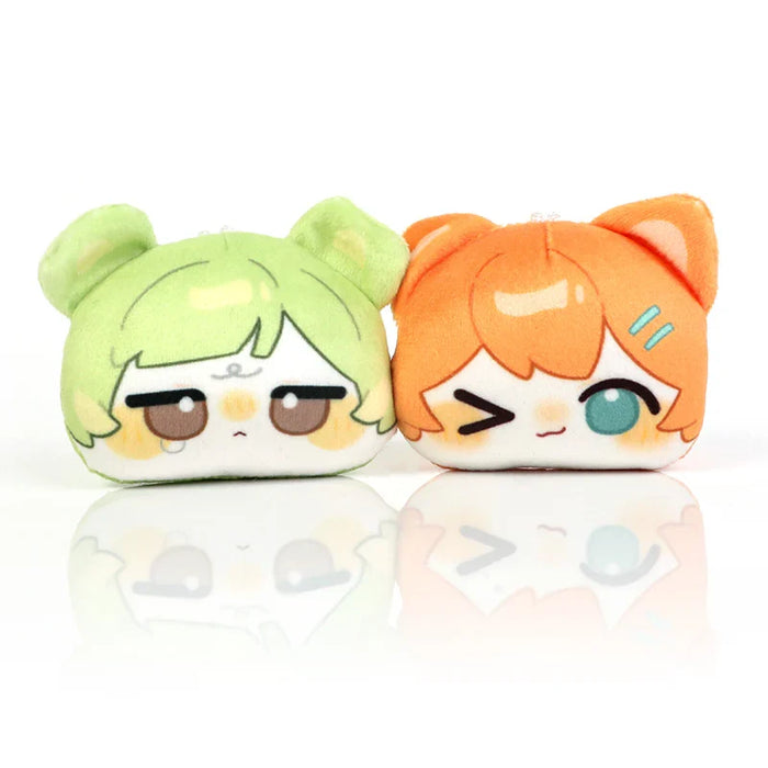 Cute anime-style plush keychains with green and orange hair, cat ears, and expressive faces on white background.