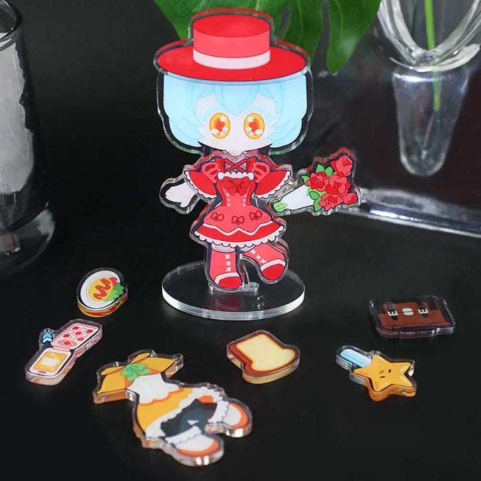 Custom acrylic magnetic dress-up standee with cartoon girl and accessory pieces on black surface