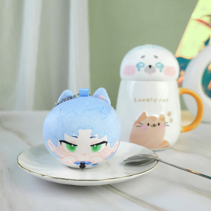 Blue cat-themed chibi plush keychain on a plate, cute animal mug in background, kawaii decor.