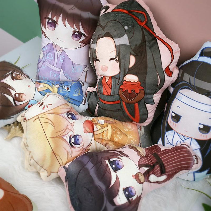Custom-shaped throw pillows featuring cute anime characters in colorful outfits, arranged on a bed.