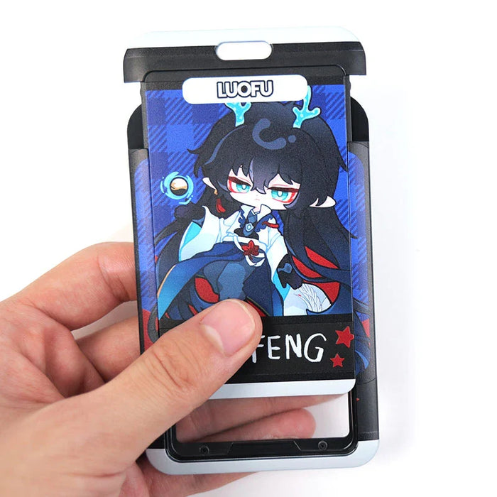 Hand holding a custom plastic card holder with anime character illustration, blue and black design.