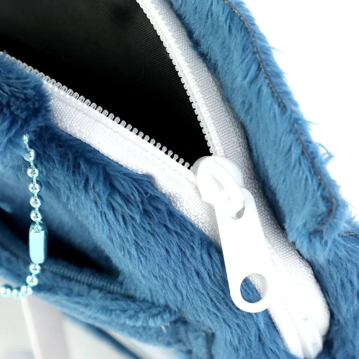 Close-up of a blue faux fur zipper pouch with white zipper and metallic chain detail