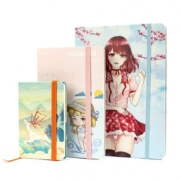 Custom printed leatherette notebooks with anime and fantasy designs, elastic bands, standing upright.