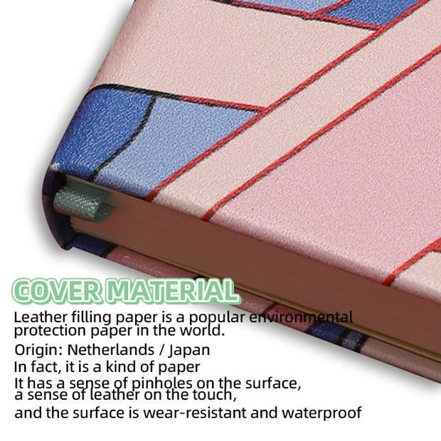 Close-up of custom printed leatherette paper notebook with colorful geometric cover and textured surface.