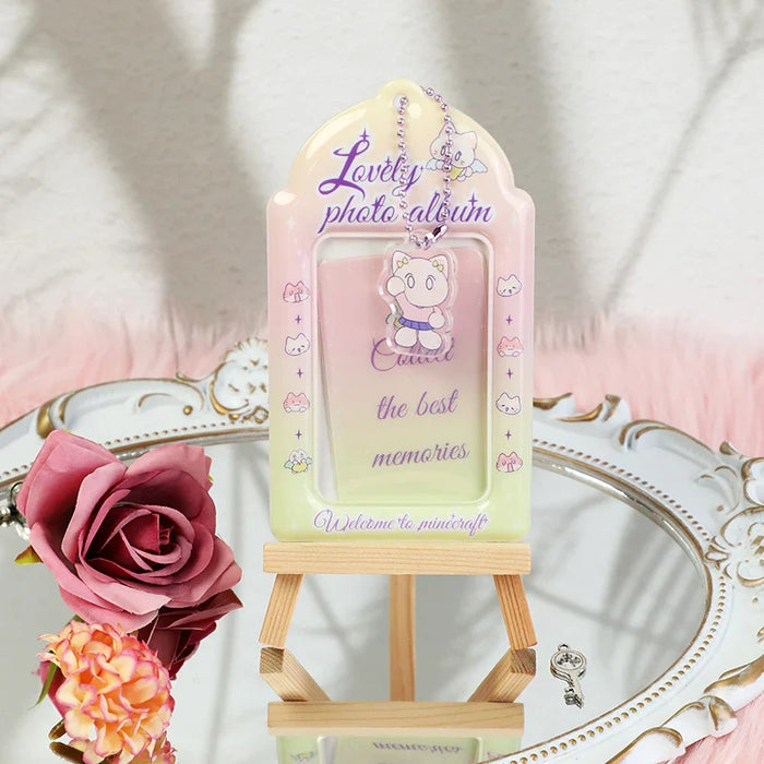 Custom pastel PVC photocard holder with cute character charm on mini easel, decorative setting