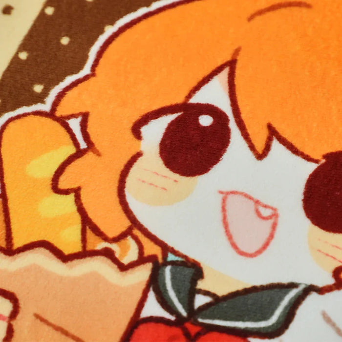 Close-up of custom coral fleece floor mat with cute anime character and orange hair design