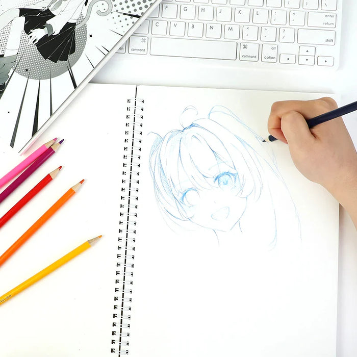 Hand sketching anime character in spiral sketchbook with colored pencils and keyboard nearby