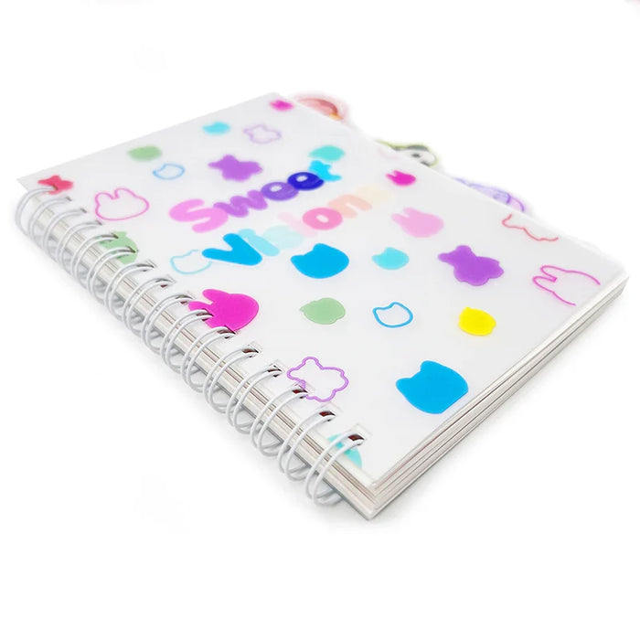 Custom spiral notebook with tabs, colorful animal shapes, and 'Sweet Vision' text on cover