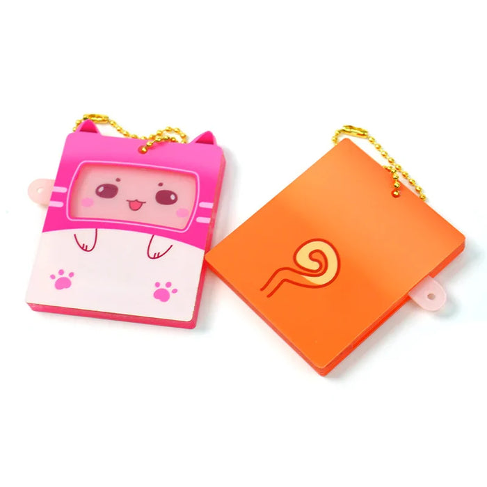 Custom switchable acrylic keychains featuring a cute pink cat design and orange pattern.