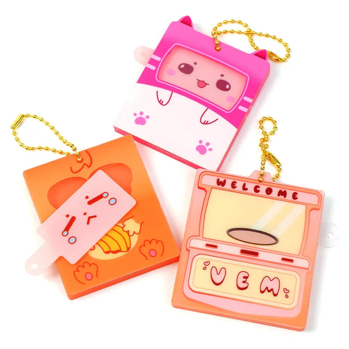 Custom acrylic keychains with cute cartoon designs and gold chains, switchable faceplates