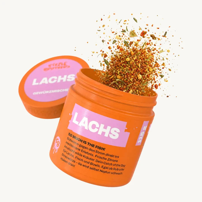 Orangene Dose mit Aufschrift 'LACHS', mehrfarbige Gewürzmischung flockt.