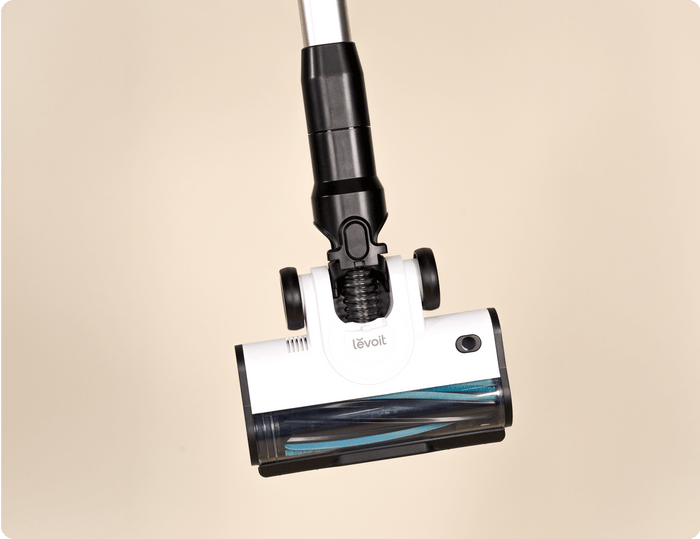 Close-up of Levoit AERO™ cordless vacuum floor head featuring TripleStrike™ anti-tangle roller brush.