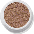 ColourPop So Quiche Super Shock Shadow, a metallic olive‑taupe eyeshadow with pink and gold sparkle, catching light in its bouncy, dimpled pan inside a white twist pot, shown in a clean close-up on a white background.