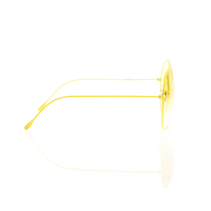 Carmen sol sunglasses with yellow frames hit the beach in style.